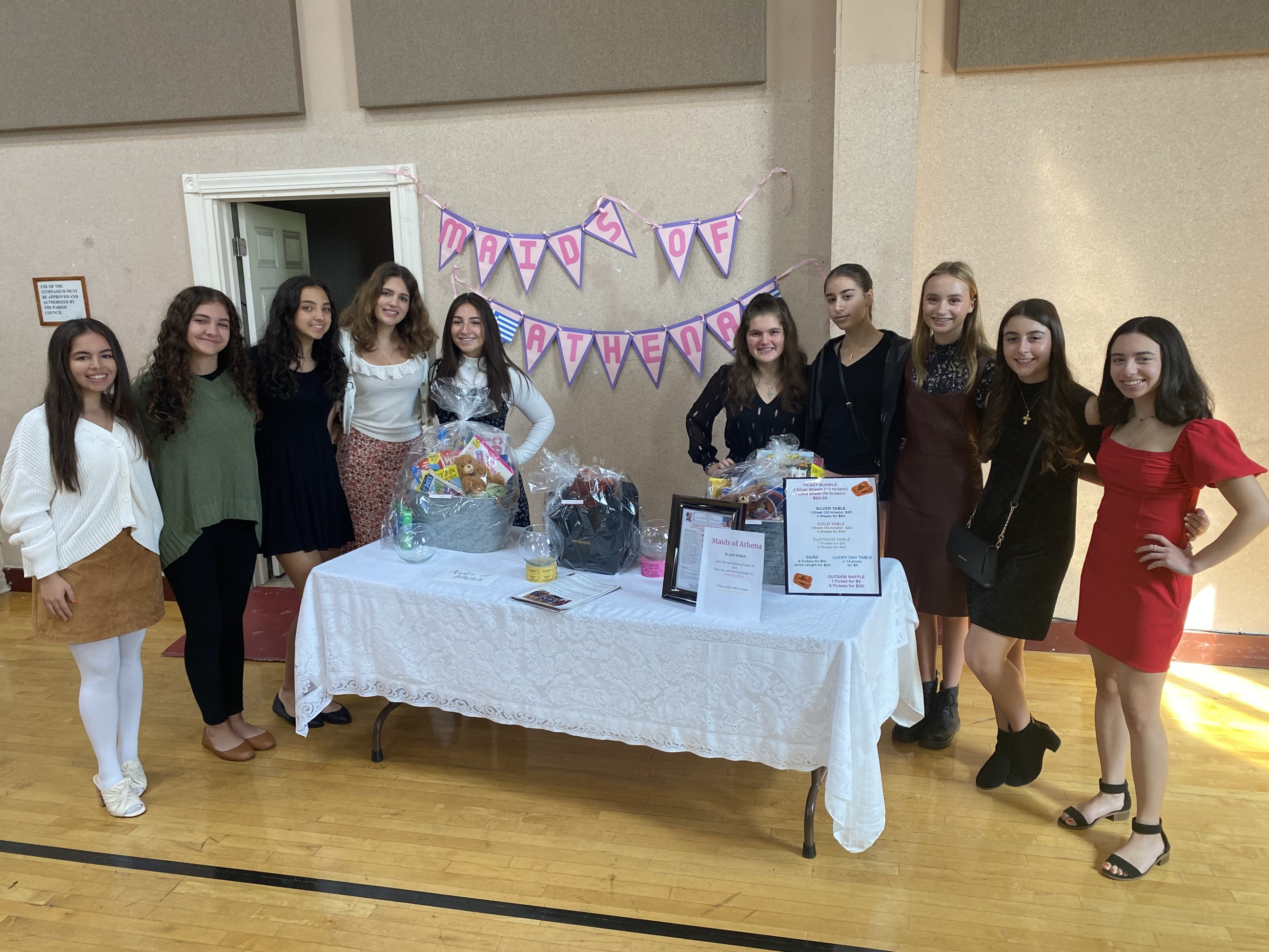 The Maids of Athena at Kimisis Philoptochos Fall Harvest Luncheon where they raised $700 from their basket fundraisers for AHEPA's Service Dogs for Warriors. 